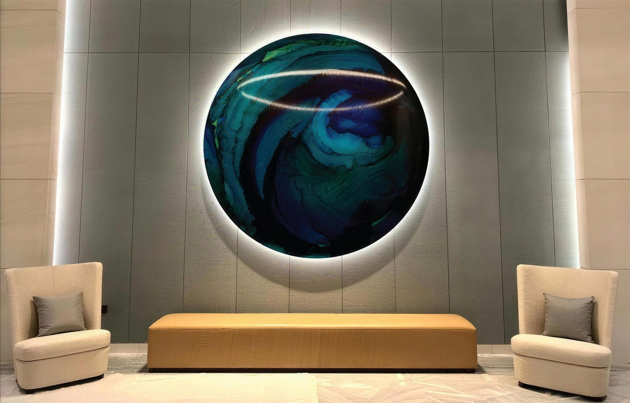 Backlit full-moon resin artwork by Dina Khataan at Atlantis The Royal