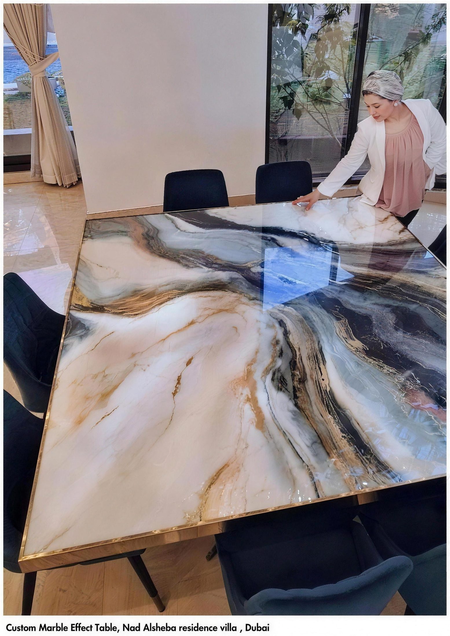 Dina Khataan finishing a resin artwork in the MOOG workshop
